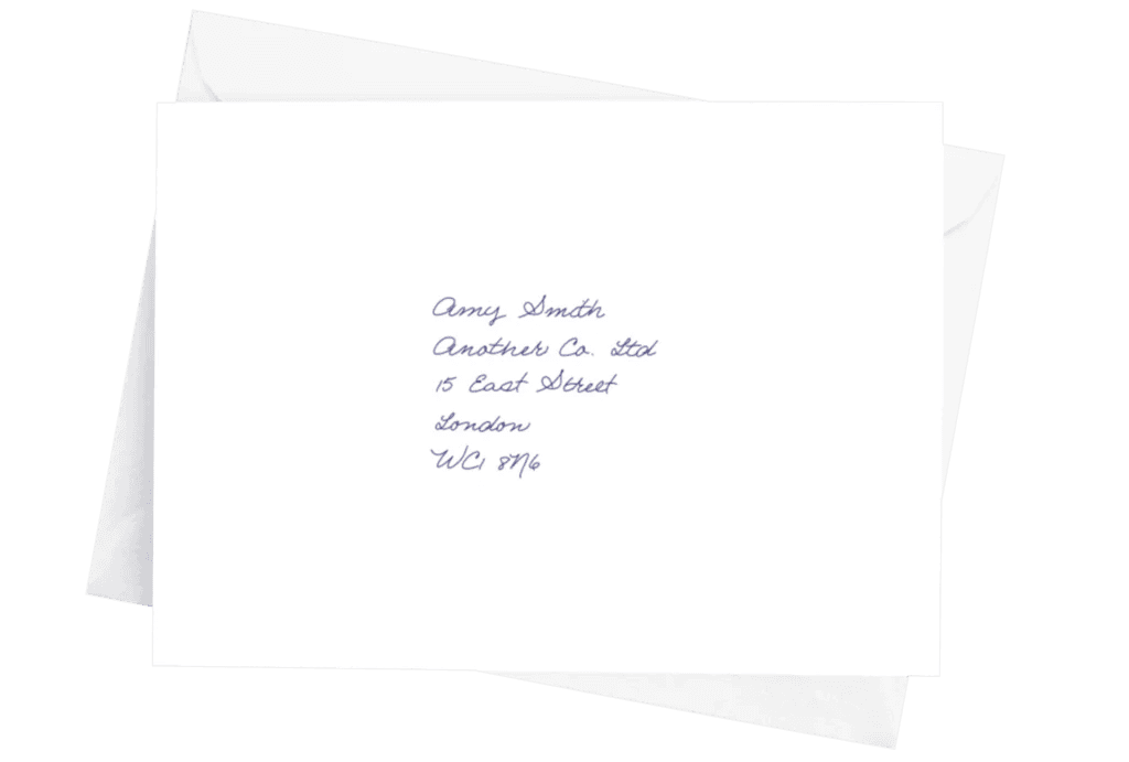 A handwritten, addressed envelope